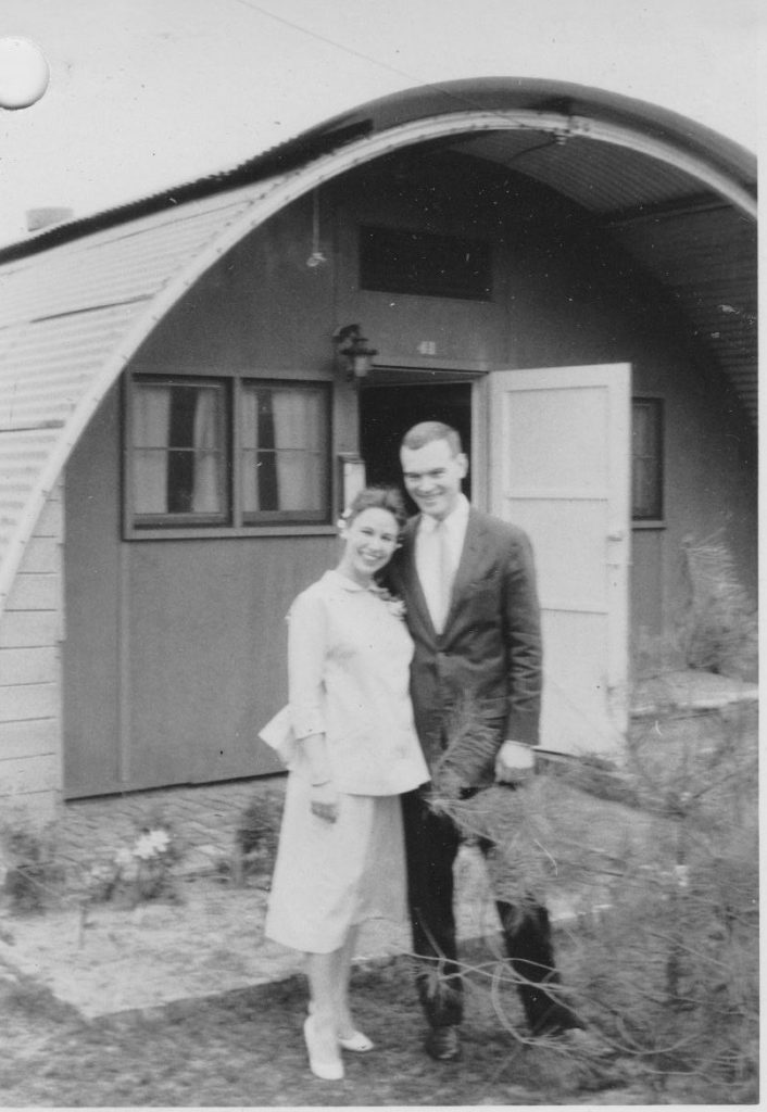 Maryann and Clovis in front of the Quonset Hut