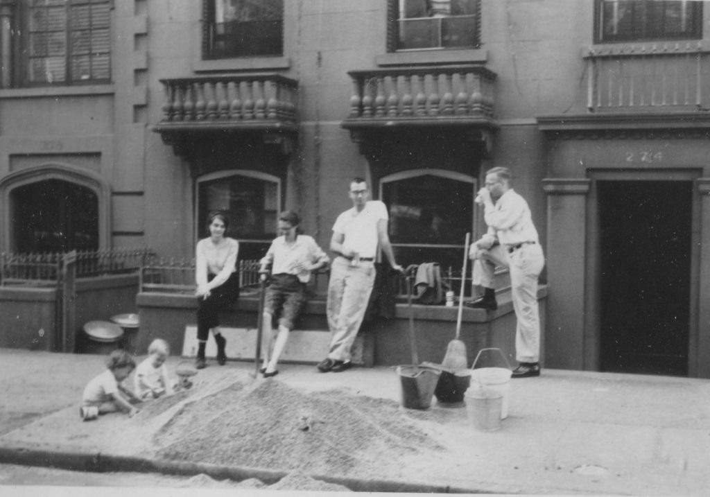 Henry Street neighbors waiting while our daughters play in the gravel that we are carrying to the back yard.