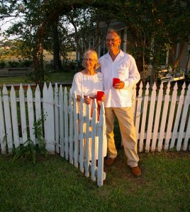 Heimsath Farm - Maryann and Clovis standing at the gate. The porch swing is in the background, it was hanging from a tree.