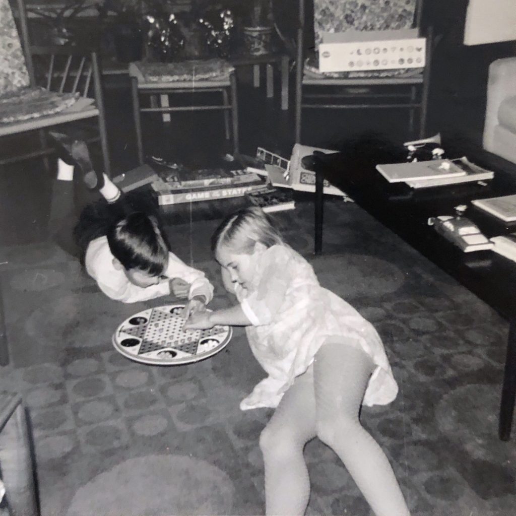 Ben and Catherine in living room playing Chinese Checkers, Christmas 1967