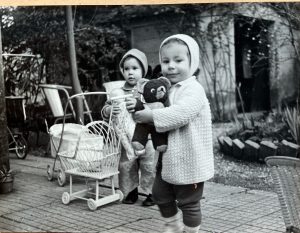 Italy - Rome - Mary Elizabeth holding a doll and Paola, the little girl who lived upstairs, holding a teddy bear. This is behind our building, in the garden.