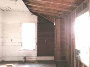 Kitchen during renovation. Look at the kitchen windows on the right, and the kitchen window in the white part of the wall. We had to lift the roof to extend it so that we could expand the kitchen.