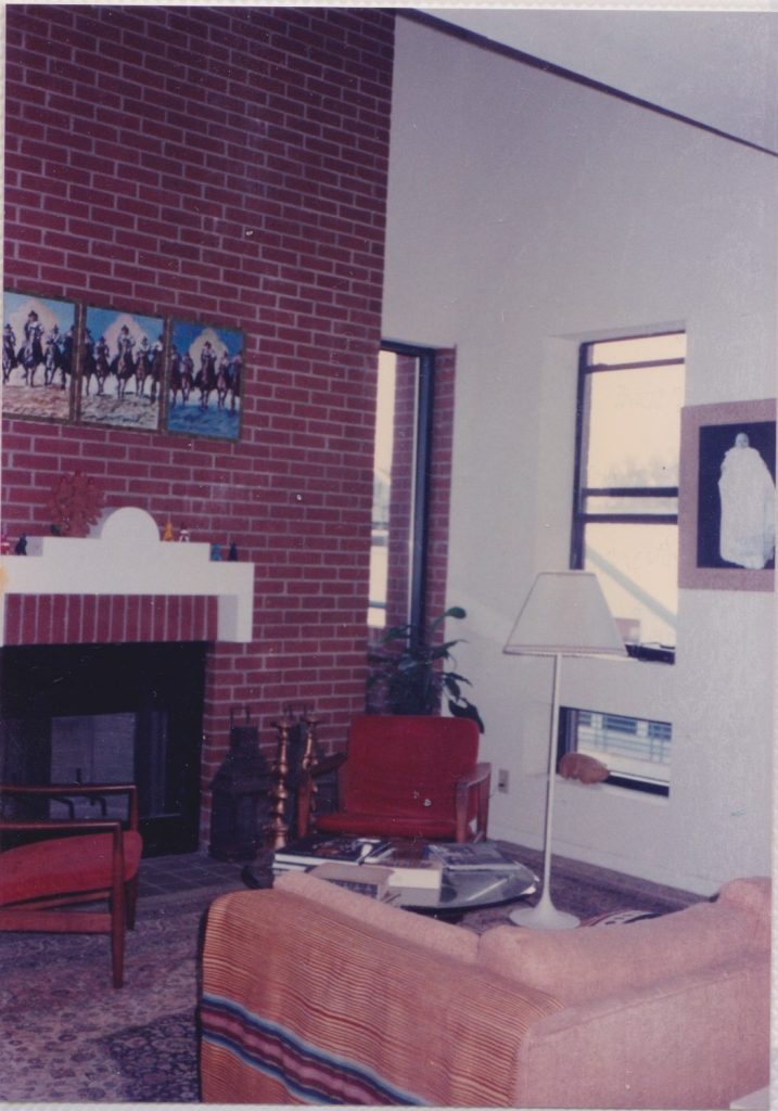 Living room with fireplace - Treaty Oak apartment